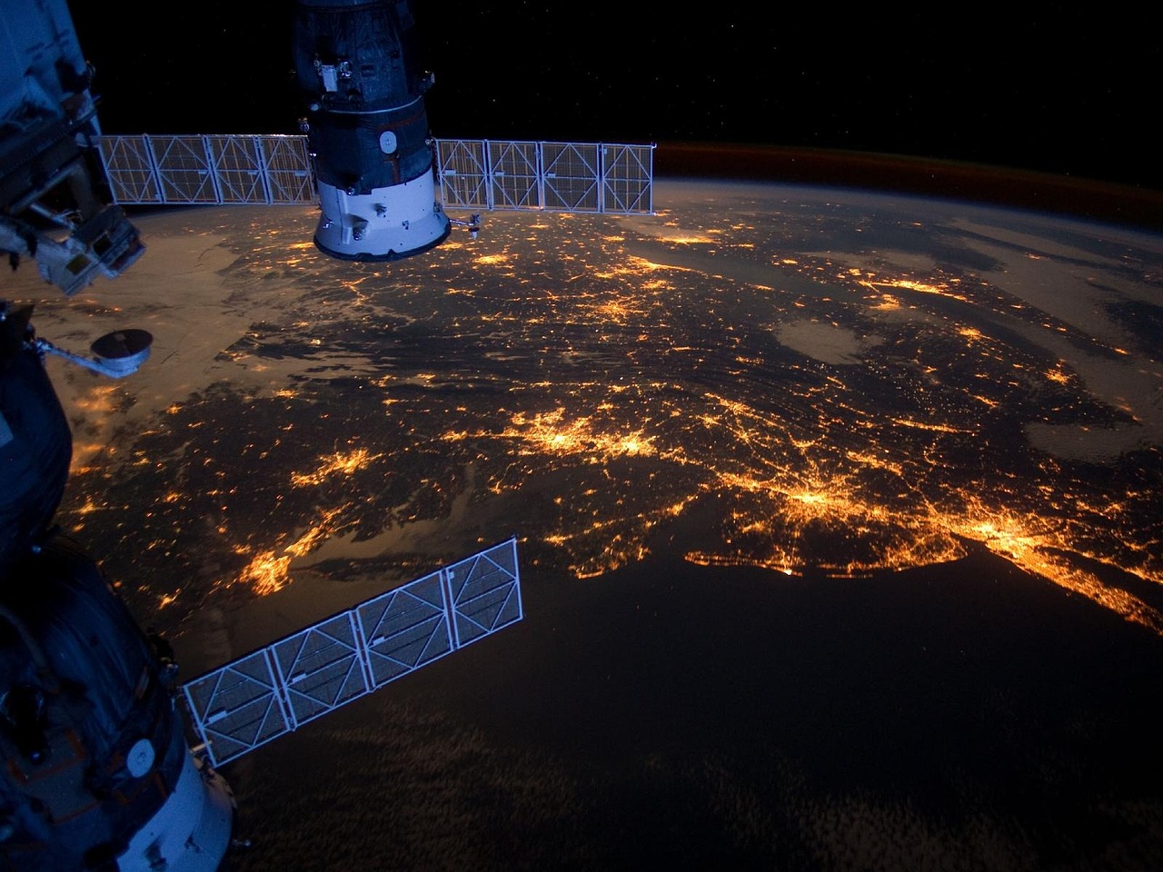 Photo of a satellite and the earth