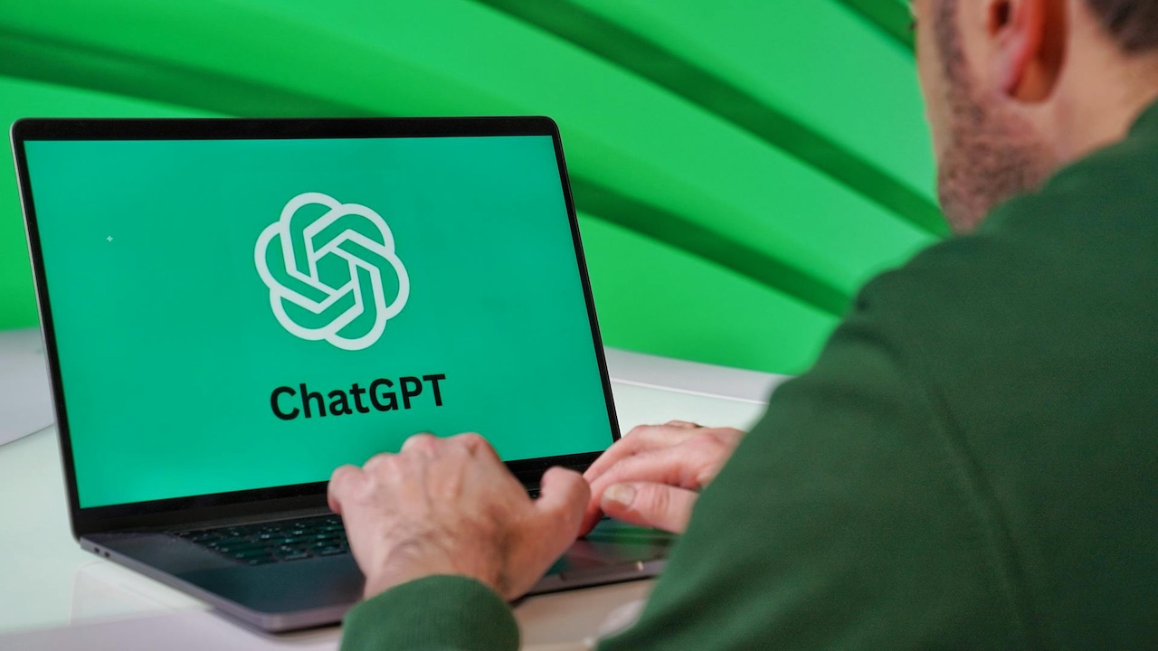 Men using ChatGPT on his laptop